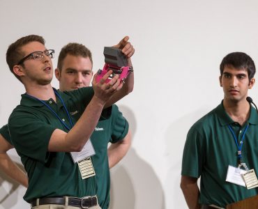 Student shows how mechanism works during BIG Idea presentation