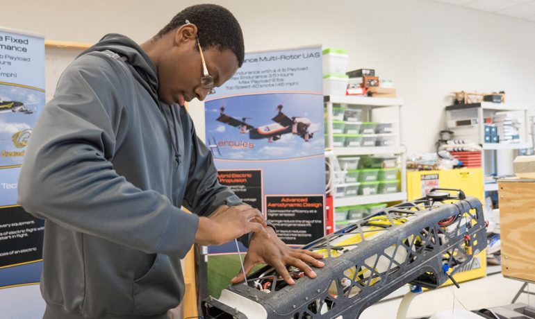 Student researcher at NIA lab turns screw in prototype